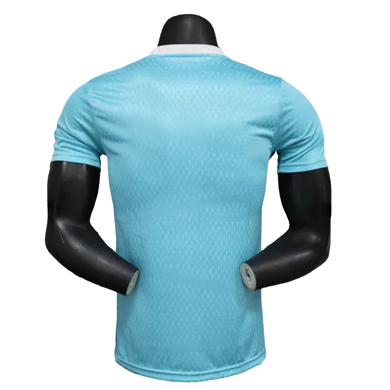 Camisola Arsenal 25/26 Pré-Jogo - Azul Celeste - Versão Jogador